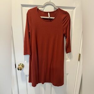 Dress, burnt red color with pockets. Size small